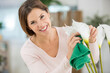 © auremar - woman cleaning some decorative flowers