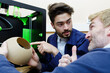 © auremar - talented engineer in a modern laboratory using a 3d printer