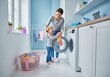© Eira - Smiling mother and daughter share a bonding moment while doing laundry together, teaching household chores