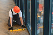 © Serhii - Worker using spirit level installing new flooring