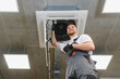© Serhii - Hvac technician performing air conditioning system maintenance work