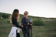 © Cristian Blázquez - Women friends walking nordic in rural nature enjoying leisure