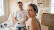© Tuwaporn - Home renovation smiles diy painting fun cozy living room image of joyful couple indoor bright and inspiring concept