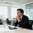 © Adobe Contributor - Businessman Contemplating in Modern Office