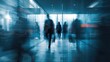 © Dewi - Blurred figures in a modern hallway, conveying movement and urban bustle