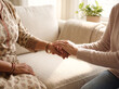 © Aurora Aesthetics - Female therapist holding hand of woman patient close up mental health support empathy therapy background copy space wellness counseling