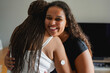 © Sabrina - Happy african mother with diabetes patch hugging daugher at home - Family love, lifestyle and people disease concept