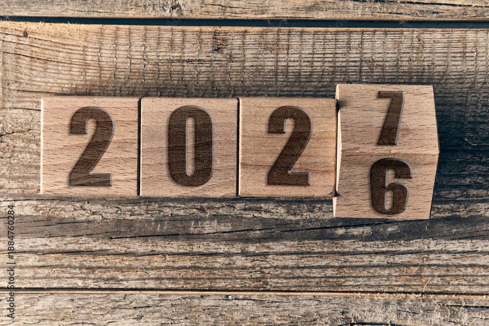 Wooden blocks showing transition from year 2026 to 2027. Financial year ...