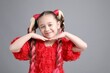 © New Africa - Cute girl with stylish pigtail braids on gray background