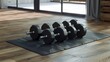 © Muhammad - A photo of a set of dumbbells on gym mats.