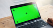 © peopleimages.com - Green screen, office and worker with laptop at desk for business website, announcement and internet. Chromakey, mockup space and person on computer for email, communication and research for planning