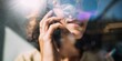 © Breezze - Young Woman Holding Smartphone to Ear for Voice Command Interface and Digital Assistant Use, Close Up of Modern Communication in Bright Natural Light with Lens Flare