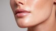 © Anastasiia - Close-up of glossy lips and smooth, dewy skin along the jawline. Concept Close-up Beauty Shot, Glossy Lips, Dewy Skin, Jawline Detail, Portrait Photography