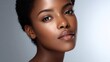 © Anastasiia - Close-up portrait of a Black woman with smooth skin, natural makeup, and glossy pink lips. Concept Close-up portrait, Black woman, Smooth skin, Natural makeup, Glossy pink lips