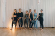 © Westend61 - Group holding yoga mats after indoor yoga session in fitness studio
