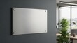 © Akash - Blank brushed metal sign mockup on dark wall in modern office interior background