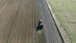 © AlexGo - Top-down view of ploughing tractor on farmland
