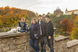 © Tomsickova - Happy family with children and dog in Kutna Hora, Czech Republic, visiting the town on an autumn sunny day
