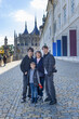 © Tomsickova - Happy family with children and dog in Kutna Hora, Czech Republic, visiting the town on an autumn sunny day
