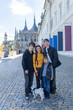 © Tomsickova - Happy family with children and dog in Kutna Hora, Czech Republic, visiting the town on an autumn sunny day