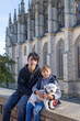 © Tomsickova - Happy family with children and dog in Kutna Hora, Czech Republic, visiting the town on an autumn sunny day