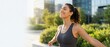 © Fernando - Woman with arms outstretched in a city park, breathing deeply and smiling with eyes closed, enjoying a moment of peace and freedom after a workout Concept of wellness, health, and urban lifestyle