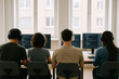 © A L P A C A - Team of programmers working together in office wearing headphones coding on computers modern workplace collaboration teamwork productivity