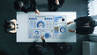 © InfiniteFlow - Professionals engage in a collaborative business meeting, discussing insights showcased on a smart home dashboard display, highlighting data analysis and modern technology trends. Trope
