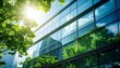 © Upnesh - Corporate Glass Building Facade Reflecting Green Trees, Defocused