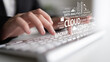 © InfiniteFlow - This image showcases hands typing on a keyboard with various cloud computing and data analytics terms, emphasizing the significance of modern digital technologies in business. Tessel