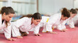 © JackF - European women doing push-ups in self-defense training