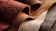 © Olga Ко - Collection of natural leather samples of different brown shades and textures in a close-up view.