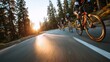 © rabbit75_fot - Cardio sports cycling biking exercise training, healthy lifestyle. A group of cyclists wearing helmets, gloves, and protective gear riding down a road at sunset.