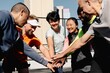 © Rawpixel.com - Diverse group of people in sportswear, hands in, showing teamwork and unity. Outdoor setting, smiling faces, mixed genders and ethnicities, bonding in sports. Teamwork happy outdoor activity,