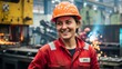 © momin - Female worker wearing red uniform and orange safety helmet at industrial site