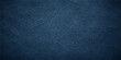 © Alpha Designs - Dark blue textured leather and fabric material background with a macro denim pattern on a rough grunge surface design
