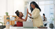© peopleimages.com - Design, high five and laptop with business people in office together for bonus or motivation. Celebration, computer and congratulations with designer team at desk in workplace for goals or success
