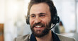 © peopleimages.com - Happy man, consultant or call center with headset for online advice, telemarketing or CRM in office. Businessman, agent or smile with mic for virtual assistance, web help or customer service helpdesk