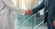 © SparkPix/peopleimages.com - Shaking hands, doctors and recruitment at hospital, lobby and thanks with agreement for hiring. People, medical staff and handshake for success, welcome or deal with onboarding in clinic hallway