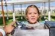 © Koldo_Studio - Happy child staying hydrated on a hot summer day, getting a refreshing drink from a public water fountain in a park