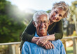 © BuyoutReese06/peopleimages.com - Portrait, smile and old couple in backyard with hug, healthy relationship and commitment in retirement. Connection, elderly man and woman with embrace, bonding together and romantic moment at home.