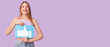 © Pixel-Shot - Beautiful young happy woman with like icon on purple background