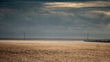 Humber Bridge spanning Humber Estuary under dramatic cloudy sky