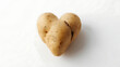 © Javeria ali  - potato shaped like a heart with subtle surface texture, isolated on clean background, symbol of love, humor, natural imperfection, and creative food concept