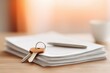 © misunderst00d - House key on top of contract document with pen on wooden table. Concept of real estate, new home, property purchase, mortgage agreement, or business deal paperwork