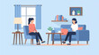 © Anam - Two women in a living room, one on a couch with a laptop, the other in a chair