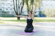 © Kritdanai - Yoga Bliss in the Park: A serene individual practices yoga outdoors on a mat, bathed in natural light, showcasing flexibility and inner peace in the heart of nature.