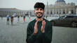 © Krakenimages.com - Young man smiling joyfully in vatican city with st. peter's basilica in the background, conveying happiness and tourism in an iconic urban setting.