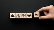 © Air stock - Hand Arranging Wooden Blocks with Teamwork and Strategy Icons on Black Background