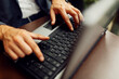 © Novak - Close-up shot of a businessman's hands typing quickly on a laptop keyboard